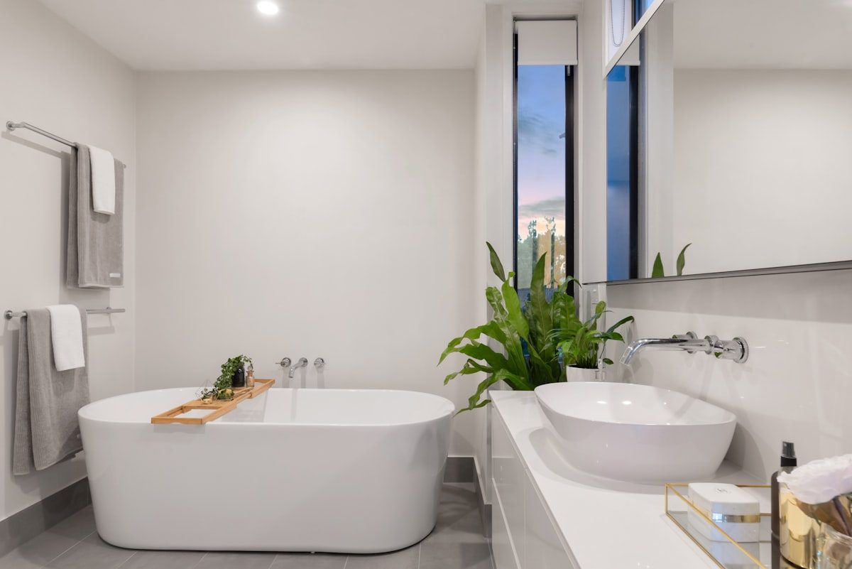 Modern spa-style bathroom remodel with freestanding tub